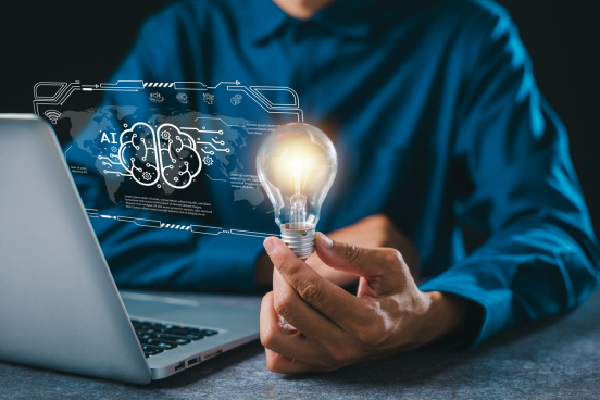 Man working in front of lapto with AI helping gnerate ideas