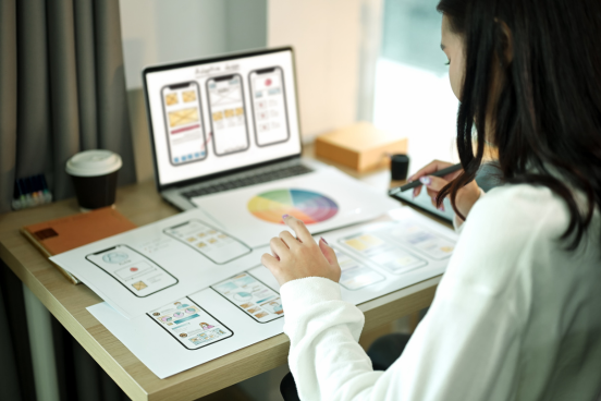 A woman building a mobile app prototype
